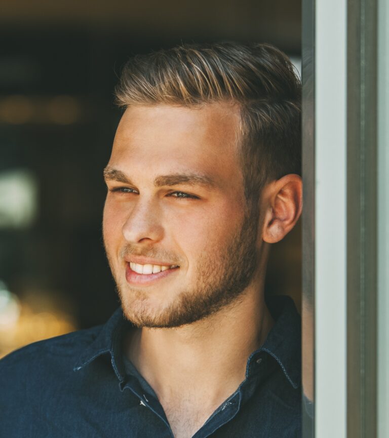 Portrait of smiling young man looking at distance
